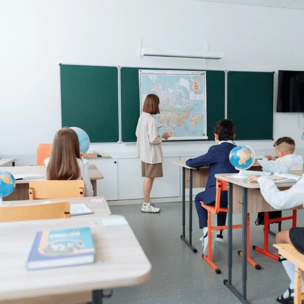 A classroom with students and teacher in it