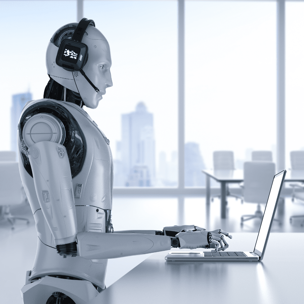 A robot is standing at the table with a laptop.