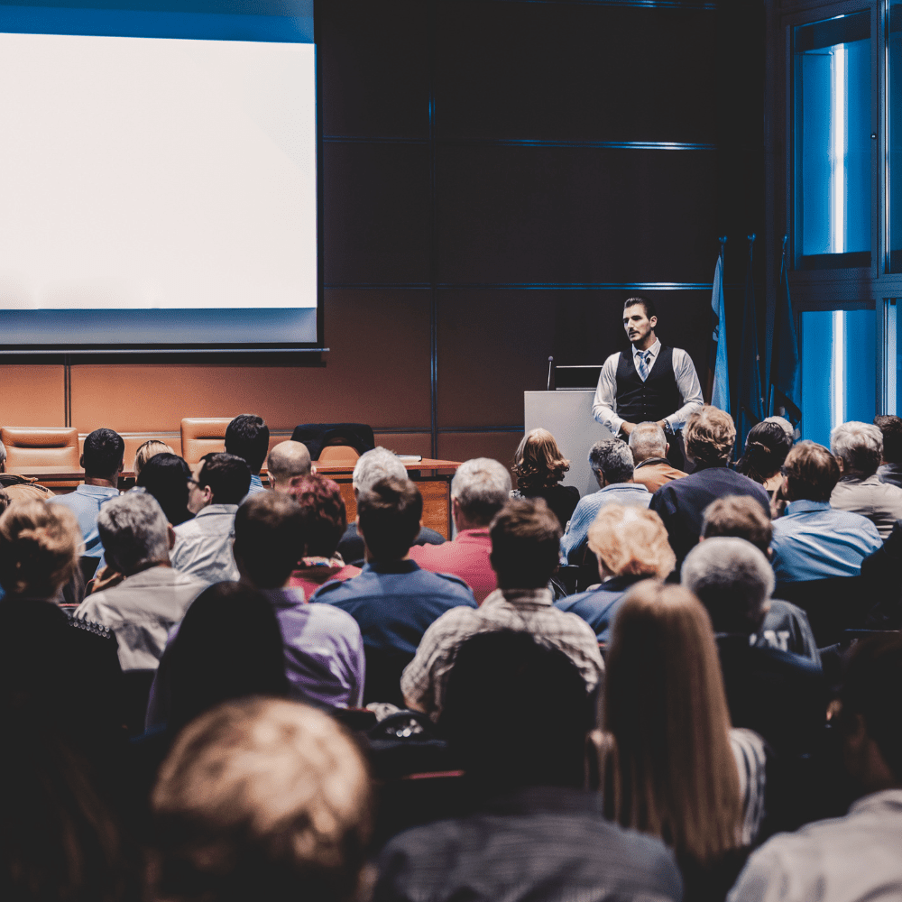 A man is giving a presentation to an audience.