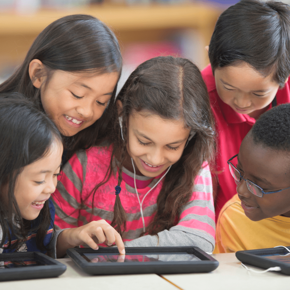 A group of children looking at an ipad.