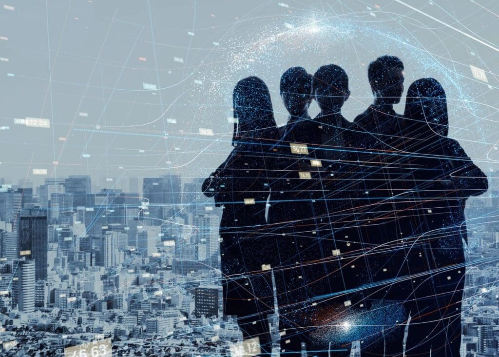 Silhouettes of four business people overlaid on a cityscape with digital network connections and data points.