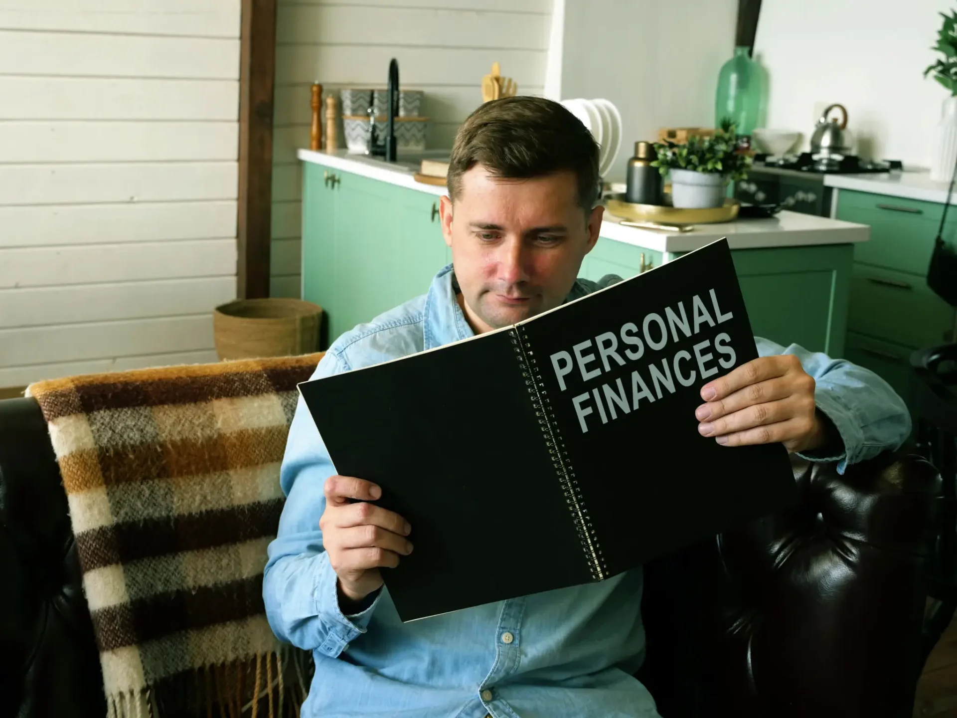 Adult reading a personal 
finance guide