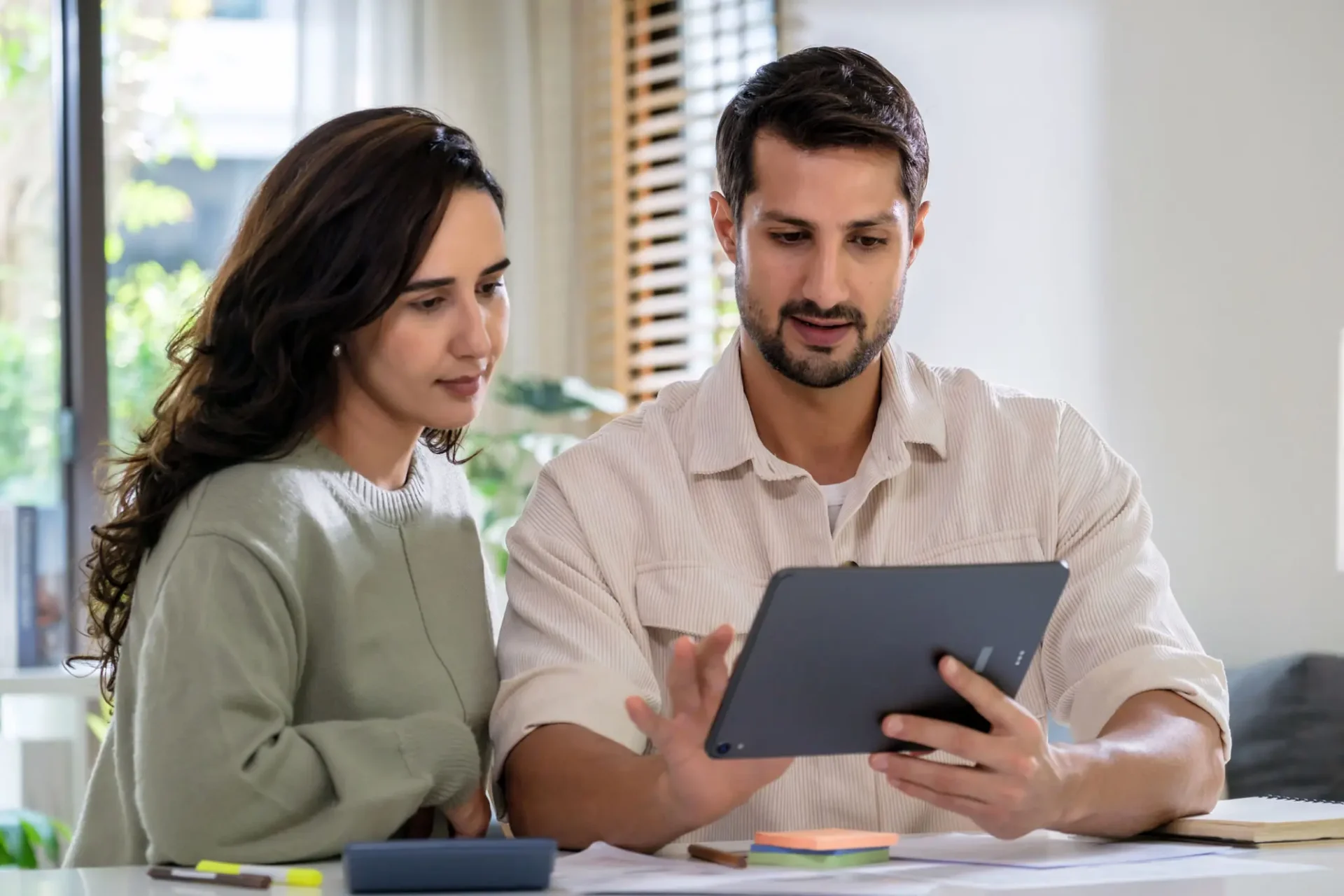 Adult couple reviewing 
retirement plans