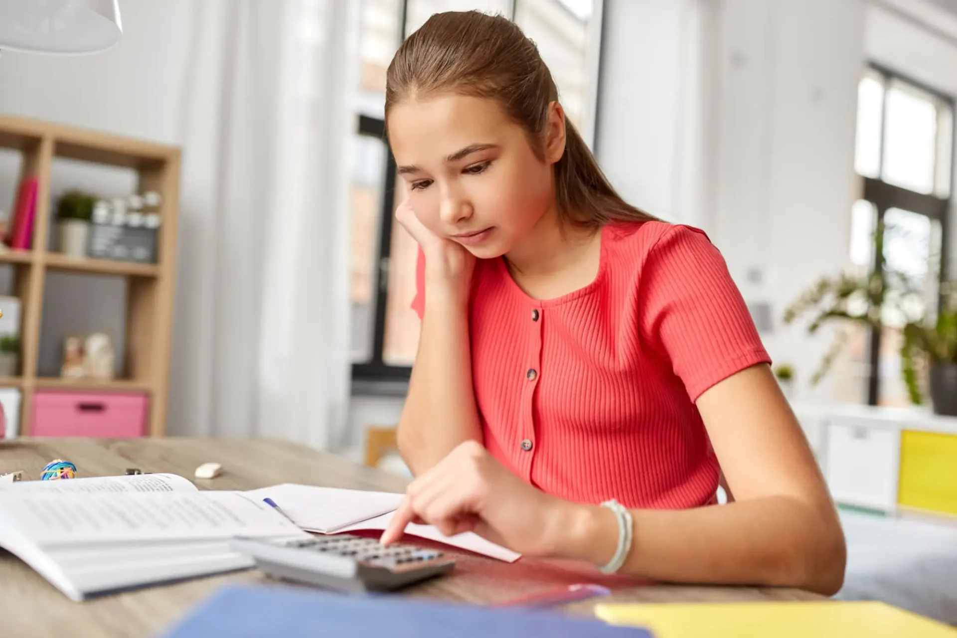 Middle school student with a 
budget worksheet